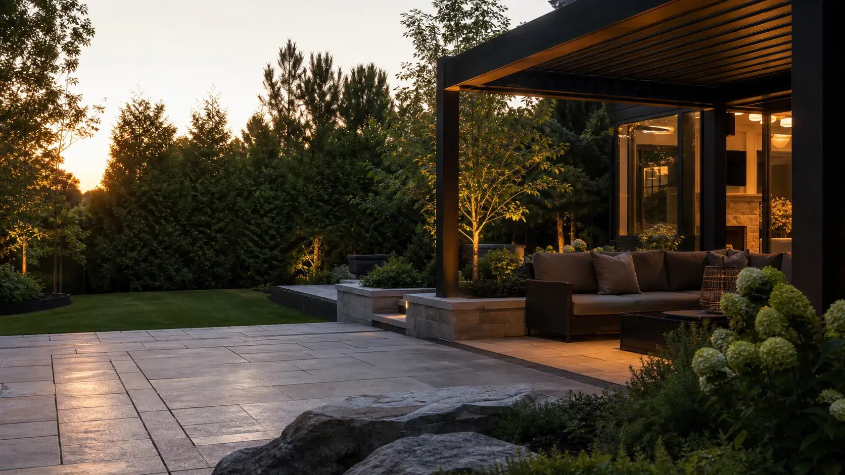 Finished stone patio and planting design at dusk